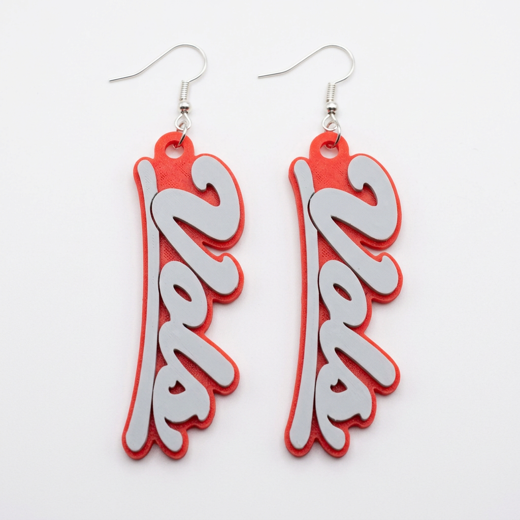 White Vols script earrings with red backing on a clean white background