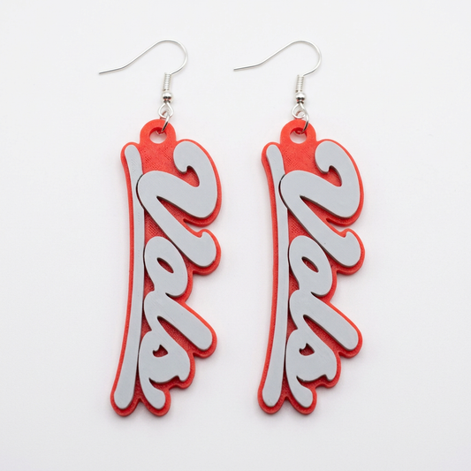 White Vols script earrings with red backing on a clean white background