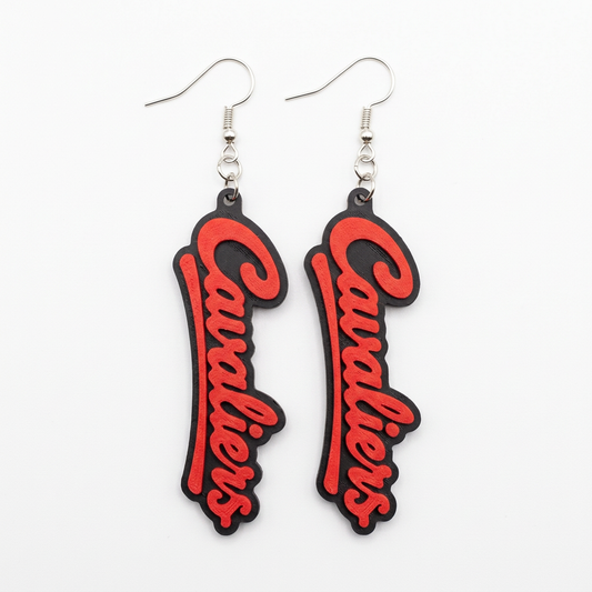 Red-and-black Cavaliers dangle earrings on a white background